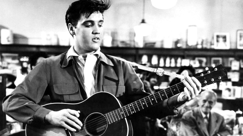 Elvis plays guitar in "King Creole" (1958)