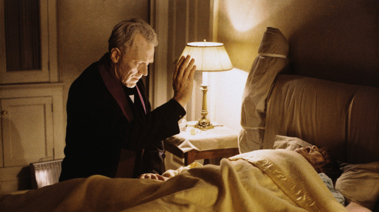 Regan possessed, with white eyes and a scarred face, in "The Exorcist" (1973)