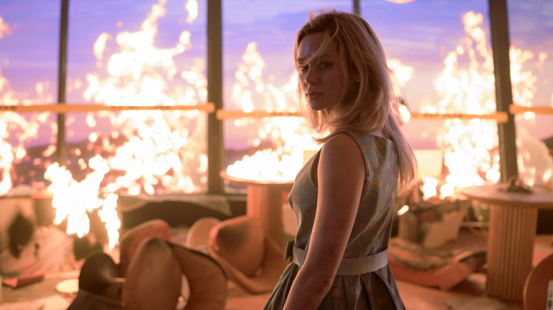 Iris looking at camera surrounded by fire