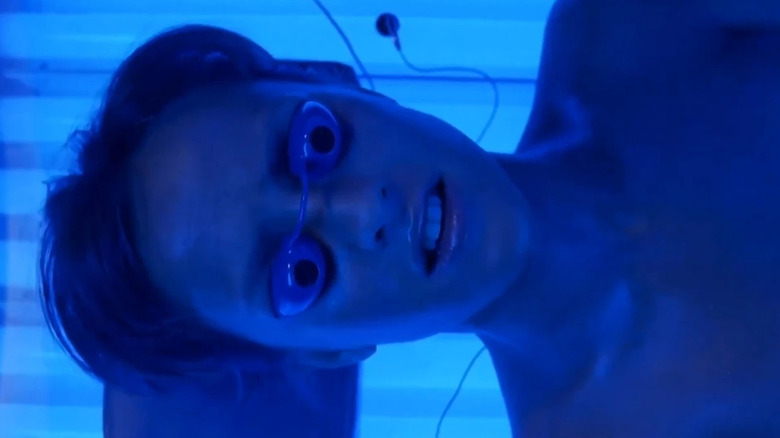 Ashlyn inside of a tanning bed in Final Destination 3