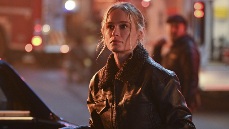 Audrey staring at a fire in 