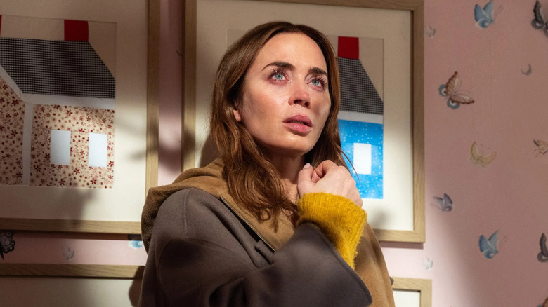 Margaret in a child's room looking up crying in Disclosure Day