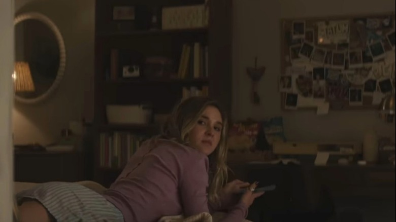Tatum Evans looking over her shoulder from her bedroom in Scream 7
