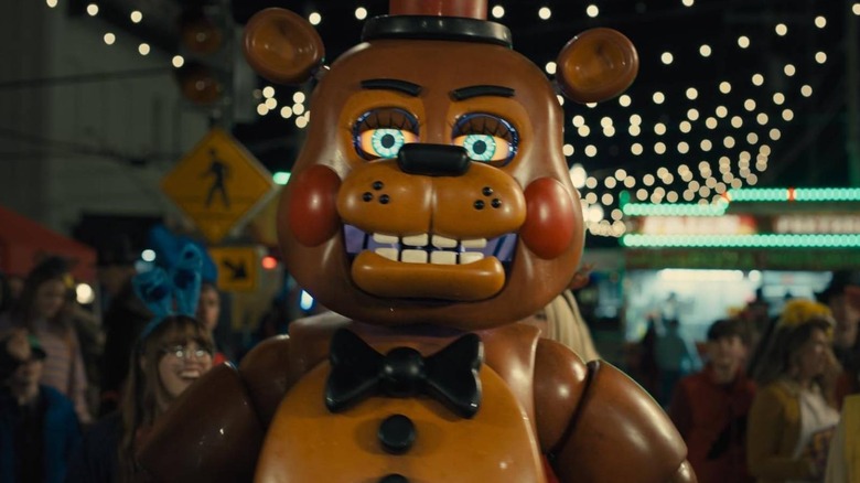 Freddy Fazbear walking around a fair in Five Nights at Freddy's 2