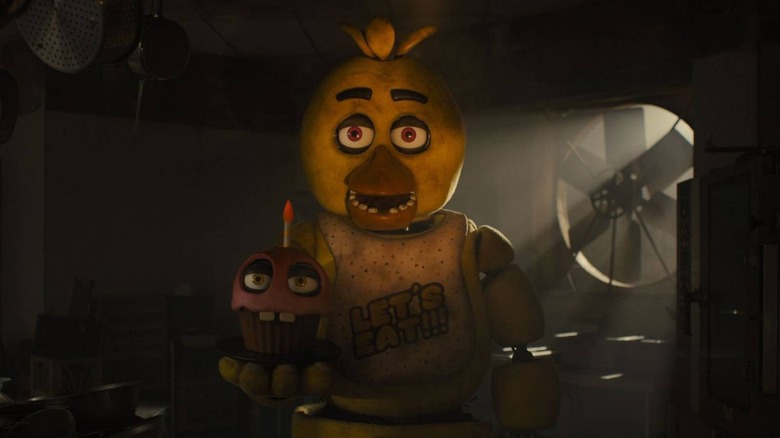 Chica holding Cupcake