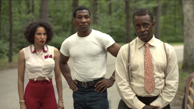 Leti, Tic, and George standing together