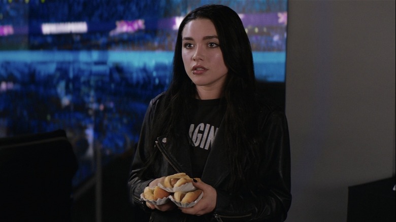 Paige carrying hot dogs