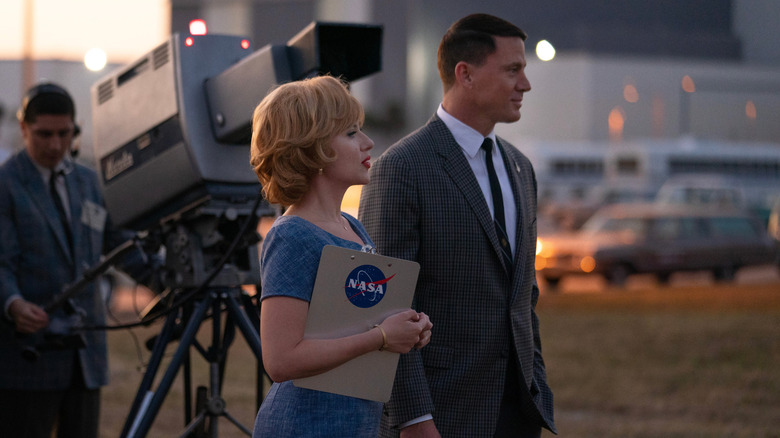 Kelly and Cole in front of a camera in "Fly Me to the Moon" (2024)