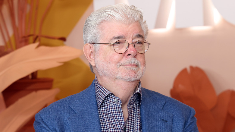 George Lucas smiling in blue suit