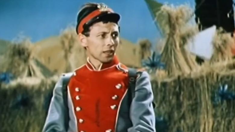 The soldier speaking while looking to his left in A Very Old Story