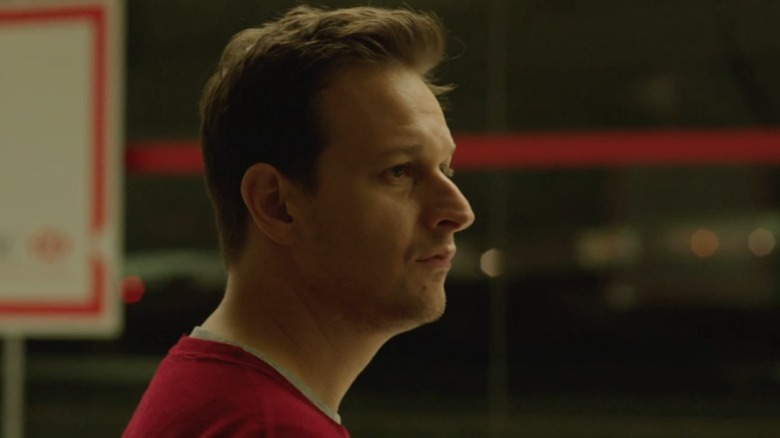 Gary Newman staring forward in Bird People