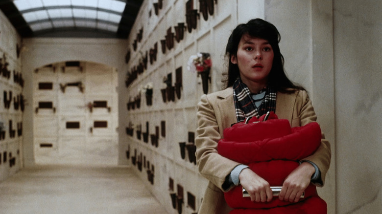 Julie looking frightened in a mausoleum in "One Dark Night"