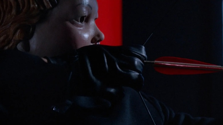 The Cherub draws back his bow to fire a red arrow in "Valentine"