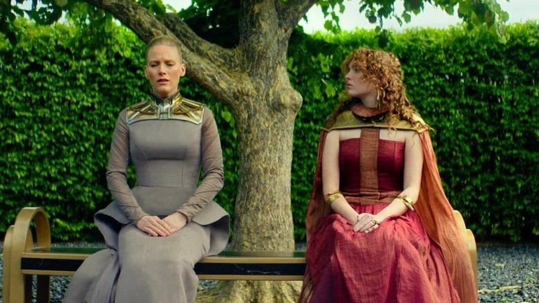 Demerzel (Laura Birn) talks with an Zephyr Vorellis (Rebecca Ineson) in a garden in 