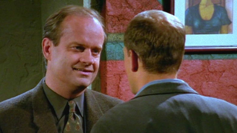 Frasier and Woody chat in a bar