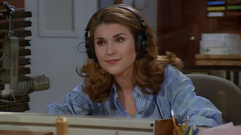 Roz wearing headphones