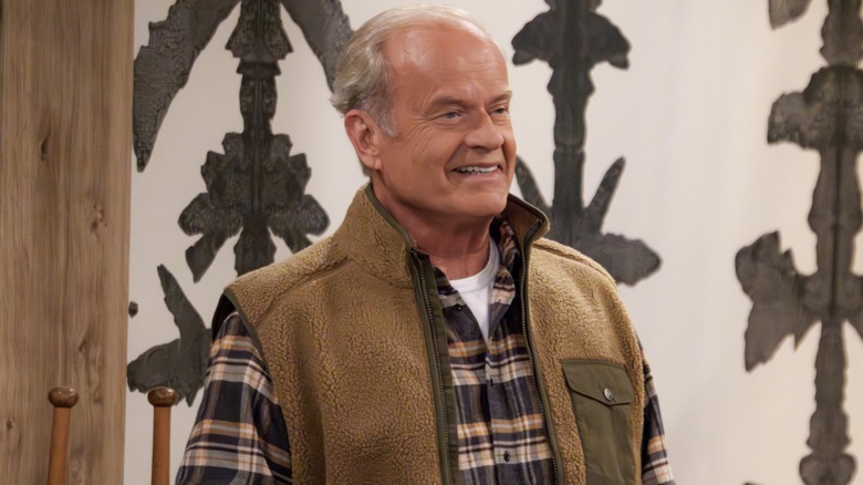 Frasier Crane grinning in apartment