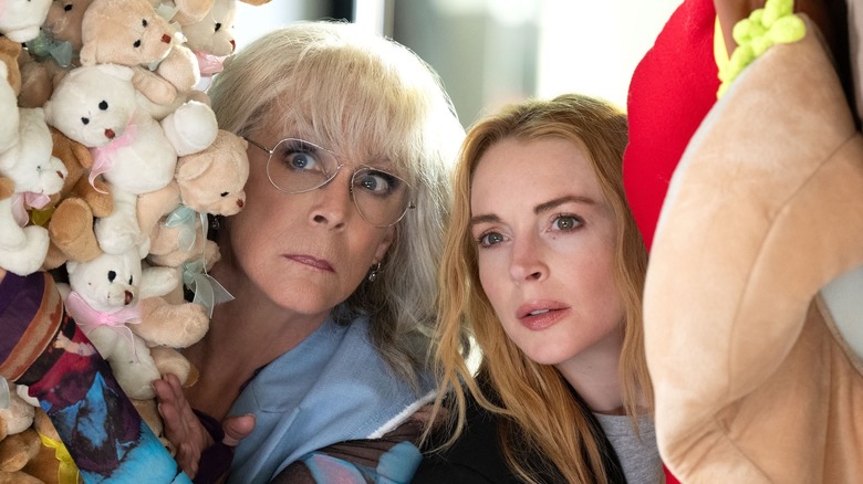 Tess and Anna spying through stuffed animals (2025)