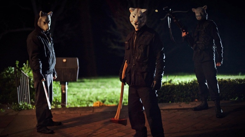 Men in masks menacing