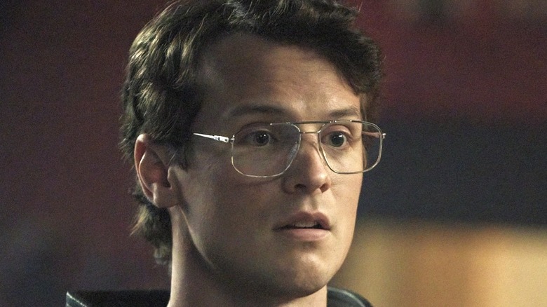 Freddie Stroma wearing glasses in "Peacemaker"