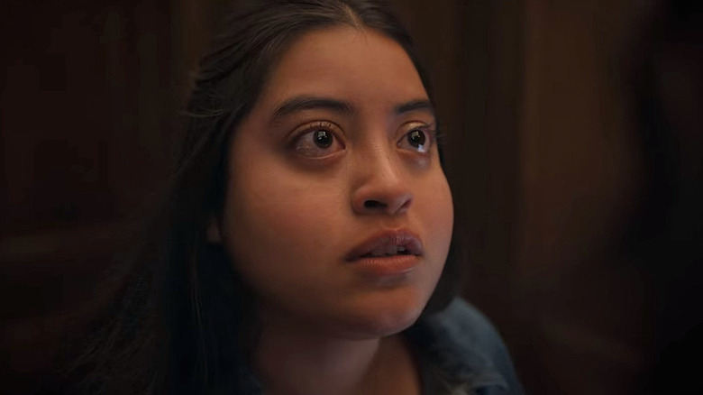 Tearful Gloria staring upward