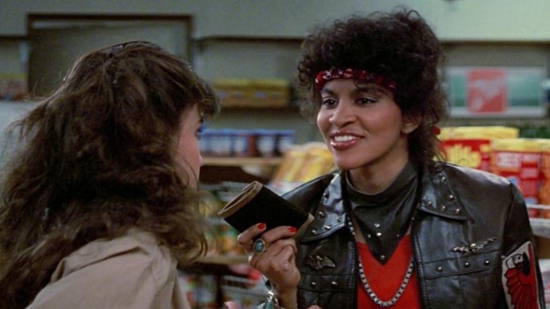 Gloria Charles holding wallet