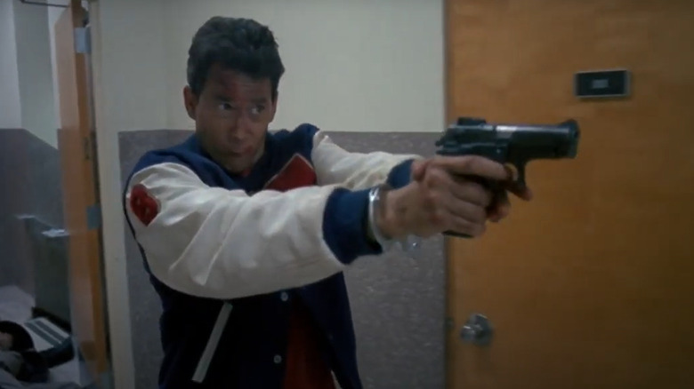 John D. LeMay pointing a gun