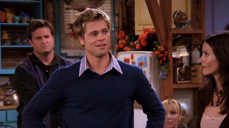 Chandler, Phoebe, and Monica looking at Will