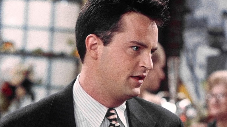 Chandler looking to the side in annoyance in 