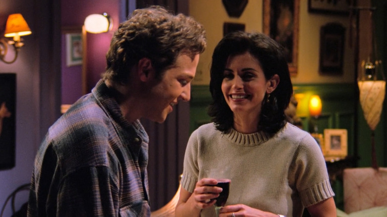 Ethan and Monica smiling in her apartment in "Friends"