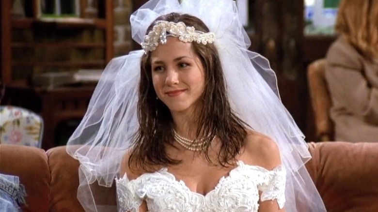 Rachel Green closed smiling to the left in wedding dress
