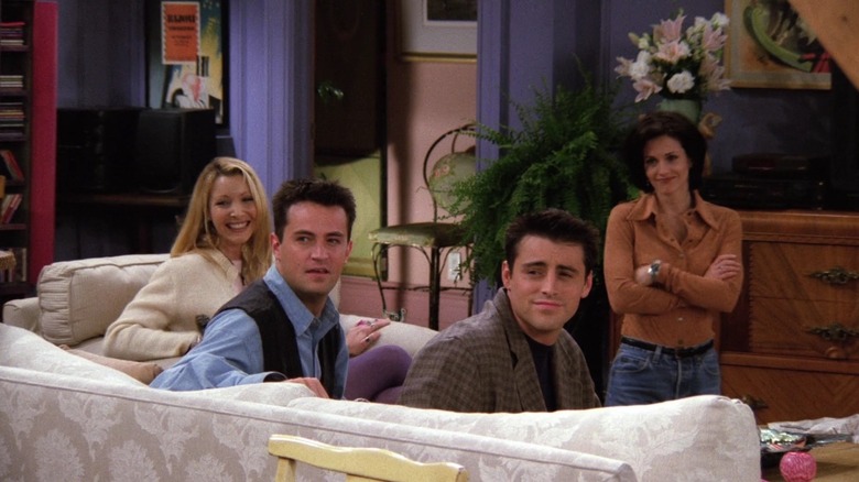 Phoebe, Chandler, Joey, and Monica looking touched