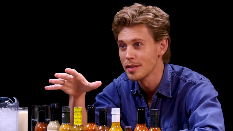 Austin Butler chats by hot sauce