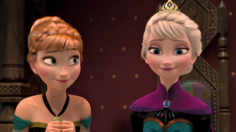 Elsa and Anna holding hands