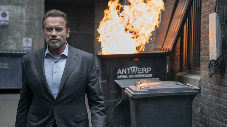 Luke walks away from a burning dumpster