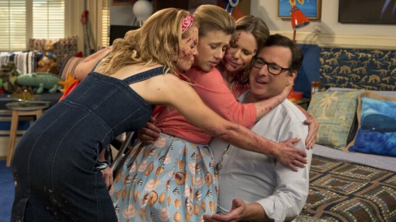 The cast of Fuller House hugging Danny