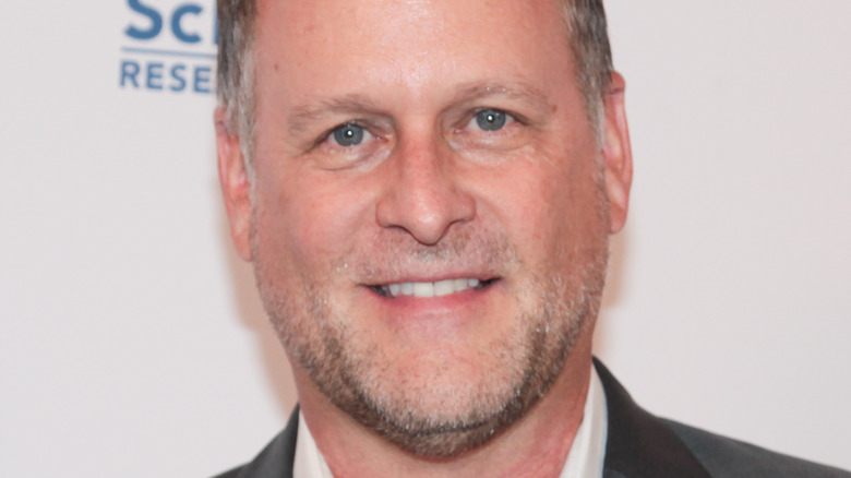 Dave Coulier smiling at an event