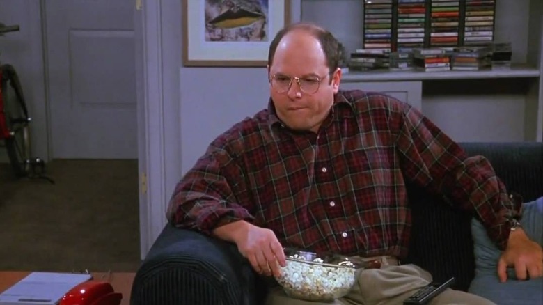 George eating popcorn