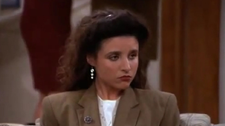 elaine giving look to side