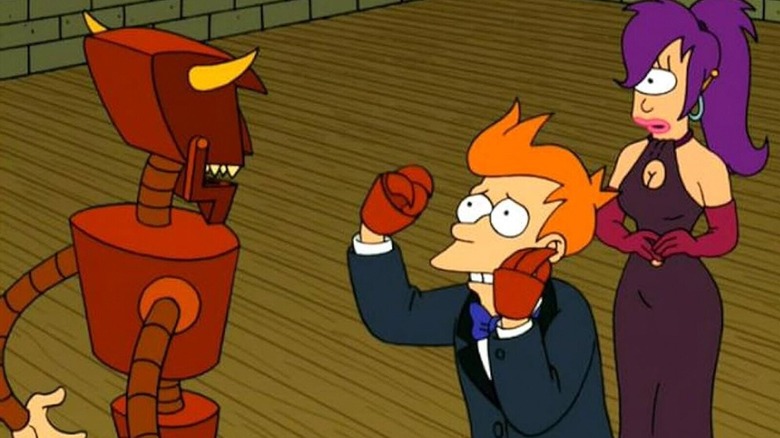 The Robot Devil standing in front of Fry as he begs him with his robot hands while Leela is standing behind him, wearing a purple dress and looking concerned, in "Futurama"