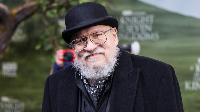George R. R. Martin posing for a photo at 