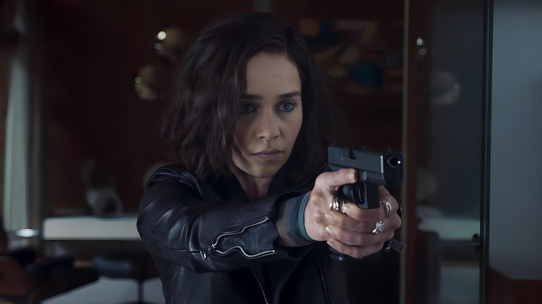 G'iah holding a gun