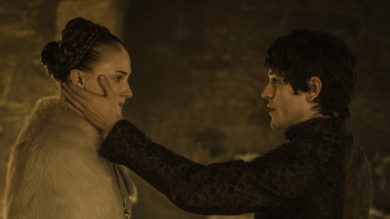 Ramsay holding Sansa's face in Game of Thrones