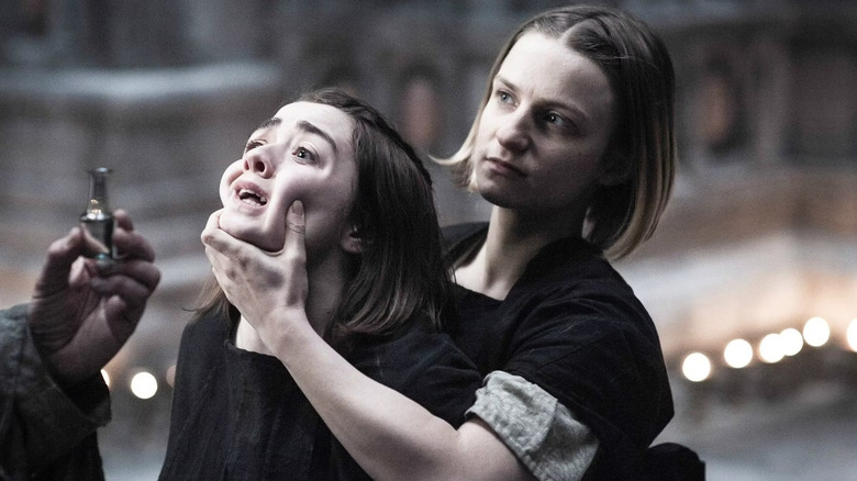 Waif holding Arya's face