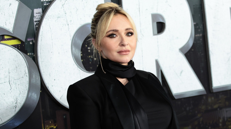 Hayden Panettiere wearing a black scarf and jacket.