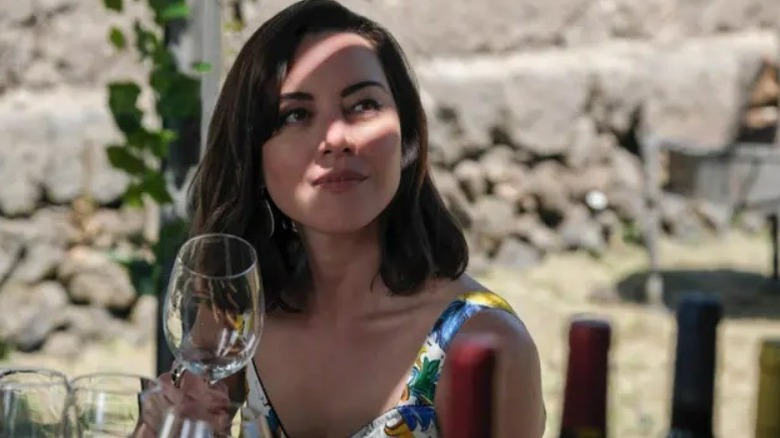 Harper holding wine glass