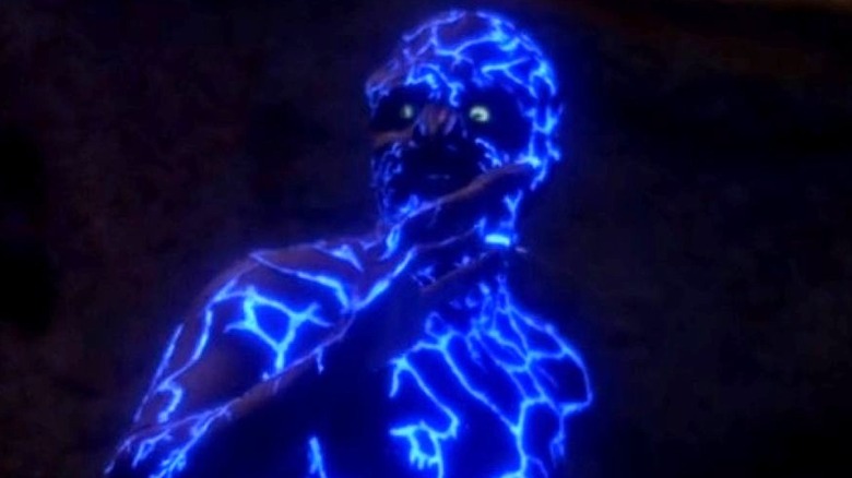 Geordi is turned blue by an alien parasite in Star Trek: The Next Generation (1991)