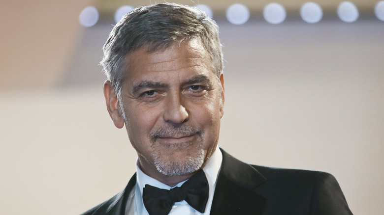 George Clooney smiling on the red carpet