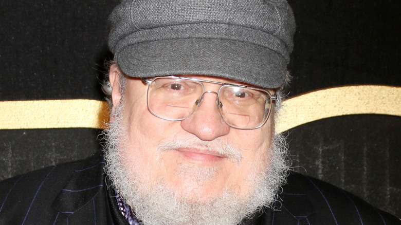 George R.R. Martin smiles at an event