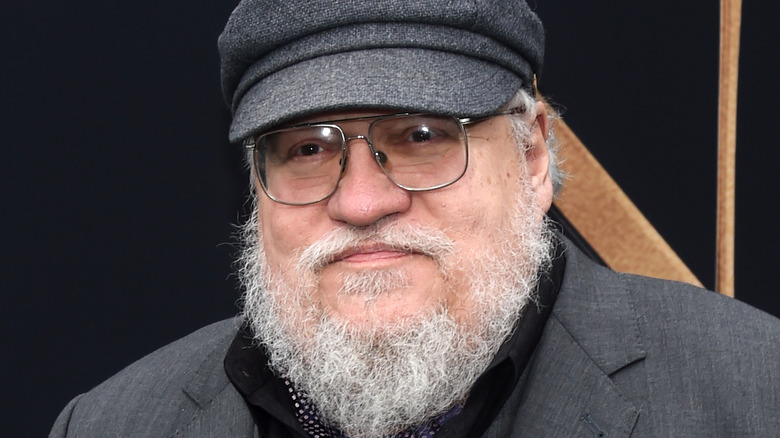 George R. R. Martin wearing a hat